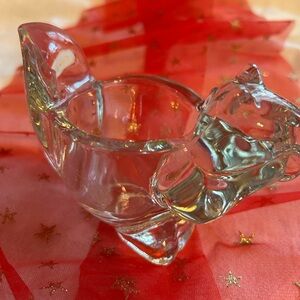 Elegant Clear Glass Accent Piece. It is a Squriel with a space for a Votive.